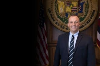 Portrait photo of Governor Josh Green